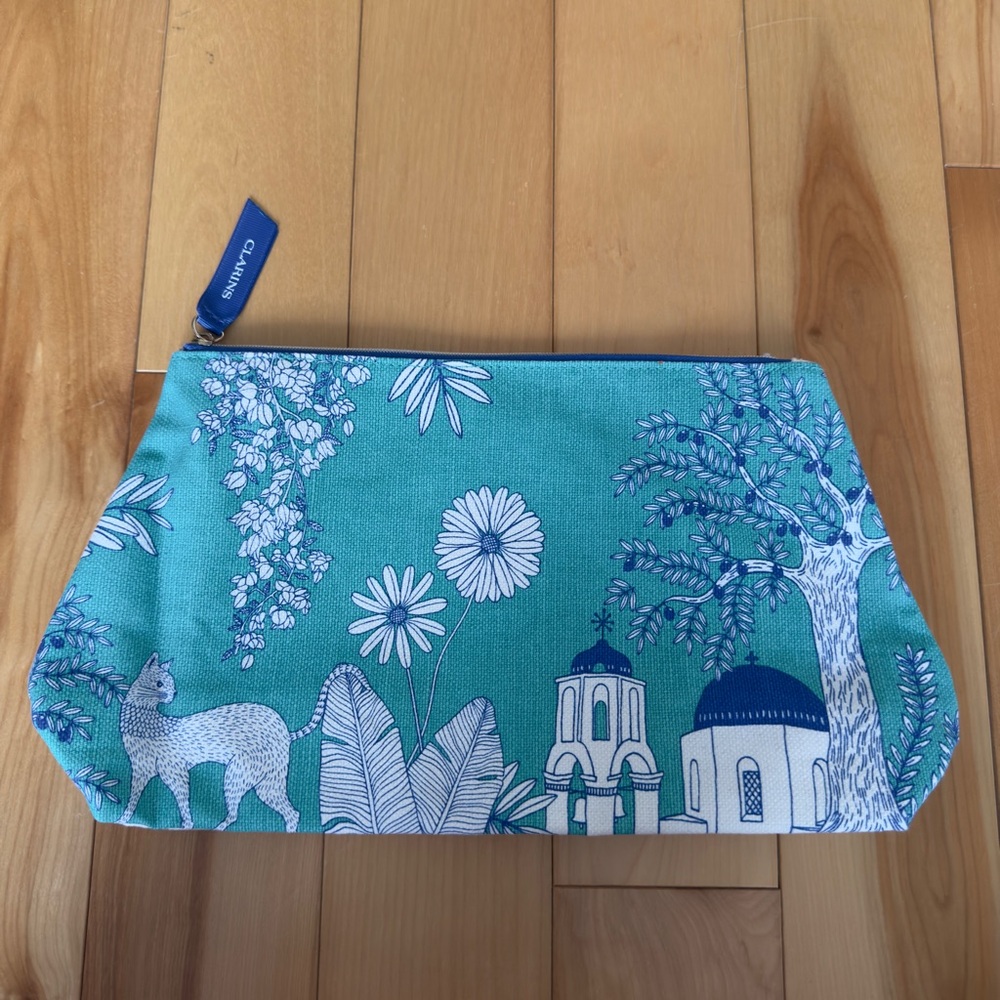 Teal and White Clarins Cosmetics Pouch